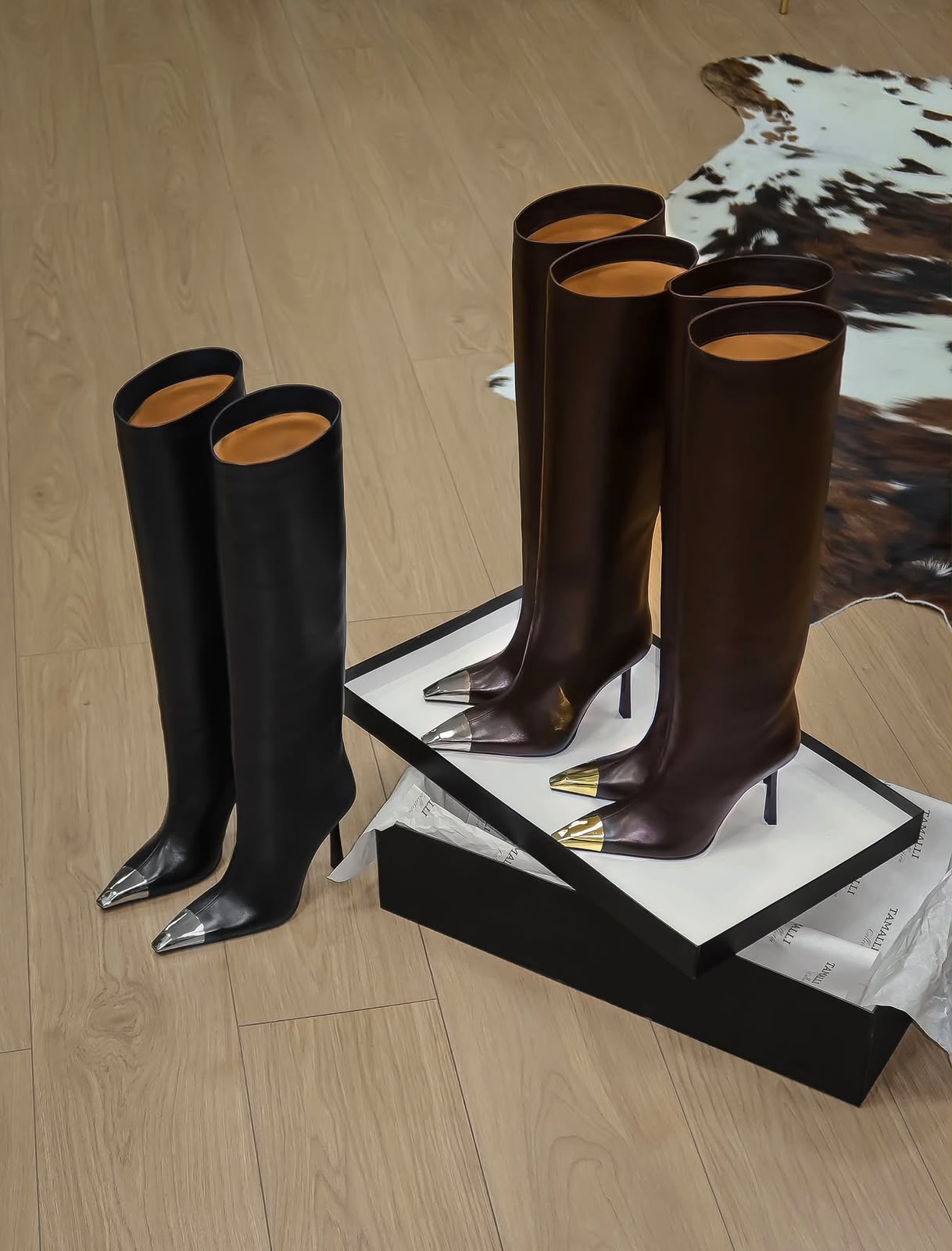 Sculptural pointed boots
